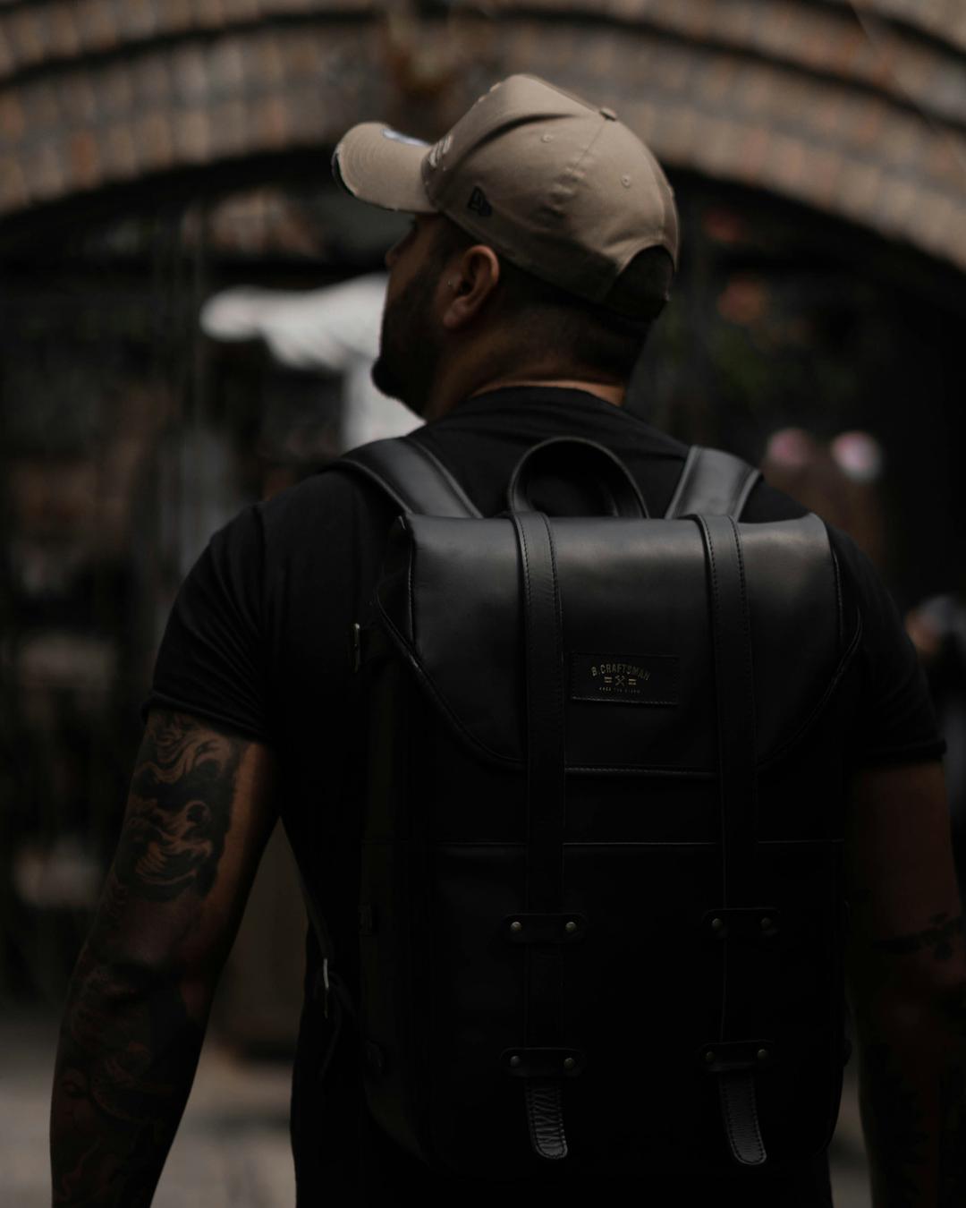 Man with leather backpack